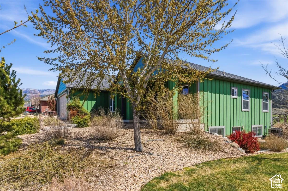 View of front of house featuring board and batten siding and an attached garage