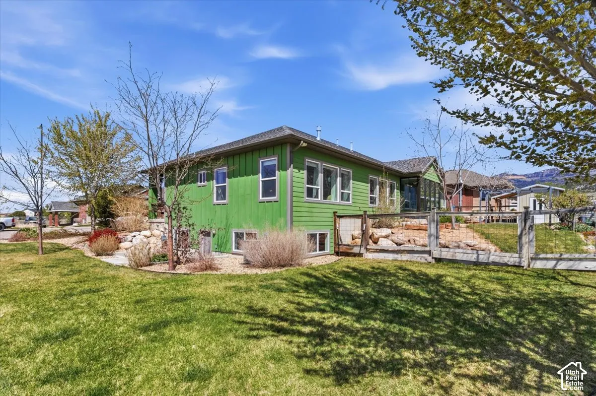 Rear view of property featuring board and batten siding