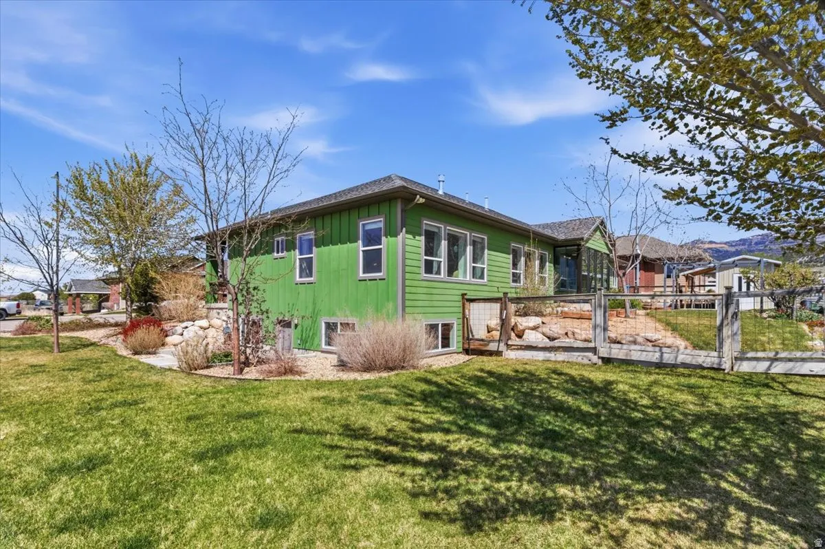 Rear view of property featuring board and batten siding