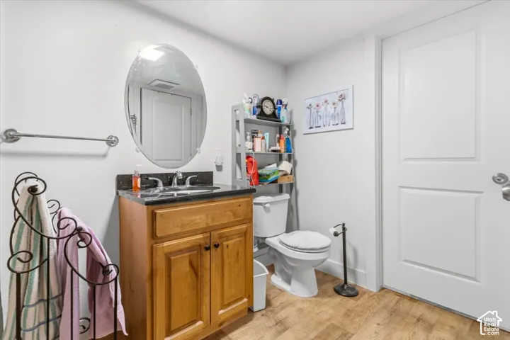 Bathroom featuring vanity and light wood-style floors