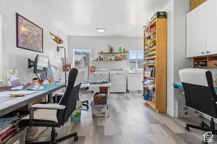 Home office with plenty of natural light and independent washer and dryer
