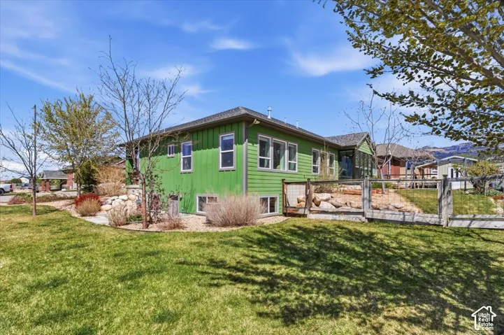 Rear view of property featuring board and batten siding