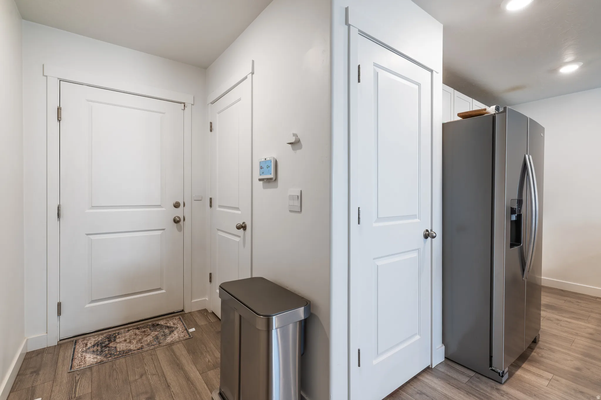 Doorway featuring wood finished floors