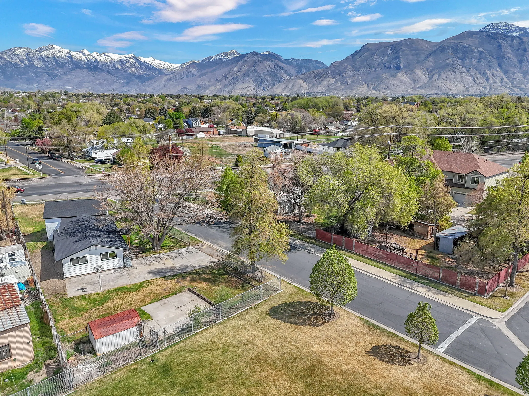 Aerial perspective of suburban area featuring a mountain backdrop