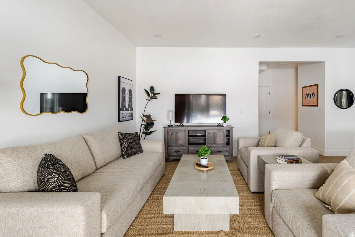 Large living room, door to the garage.