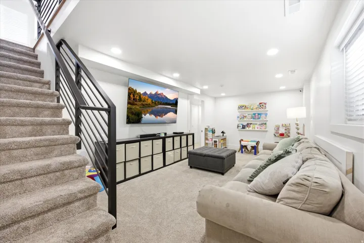 Living area featuring recessed lighting and carpet
