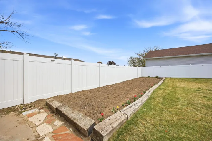 View of fenced backyard