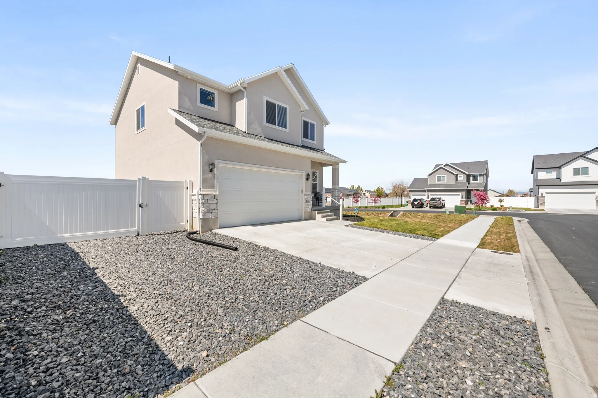 View of front of property featuring extra large gate opening for RV parking . Spacious corner lot