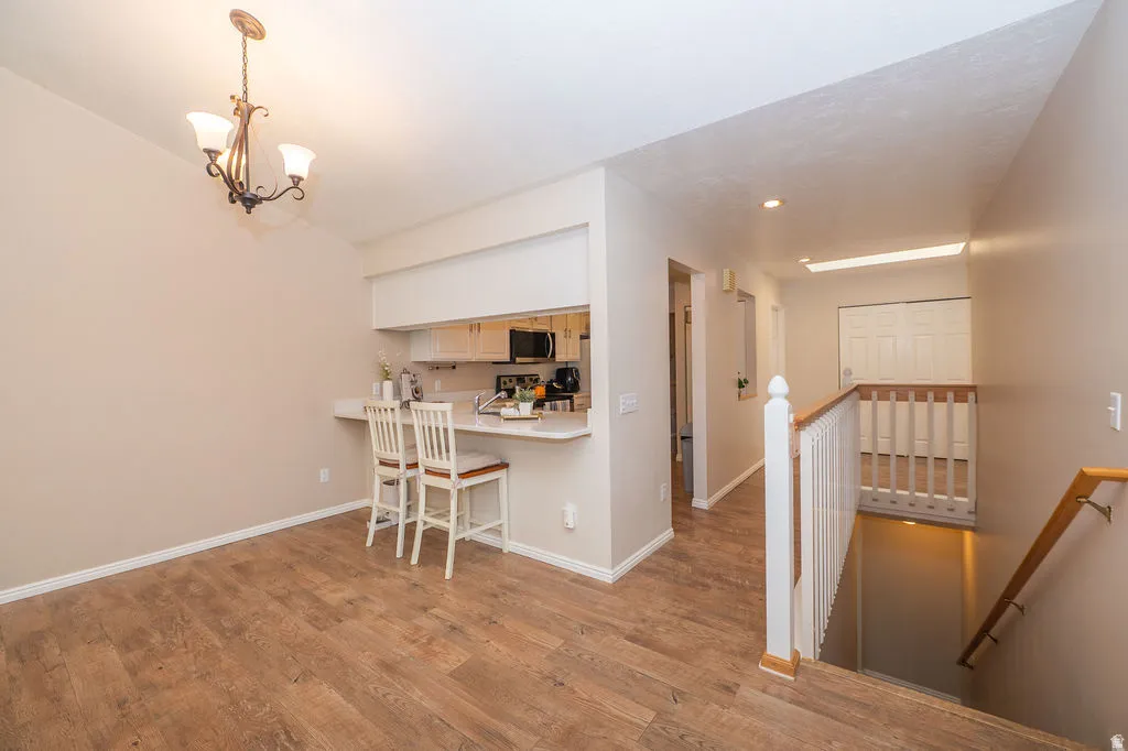 Dining area, hall, and stairs to the basement.