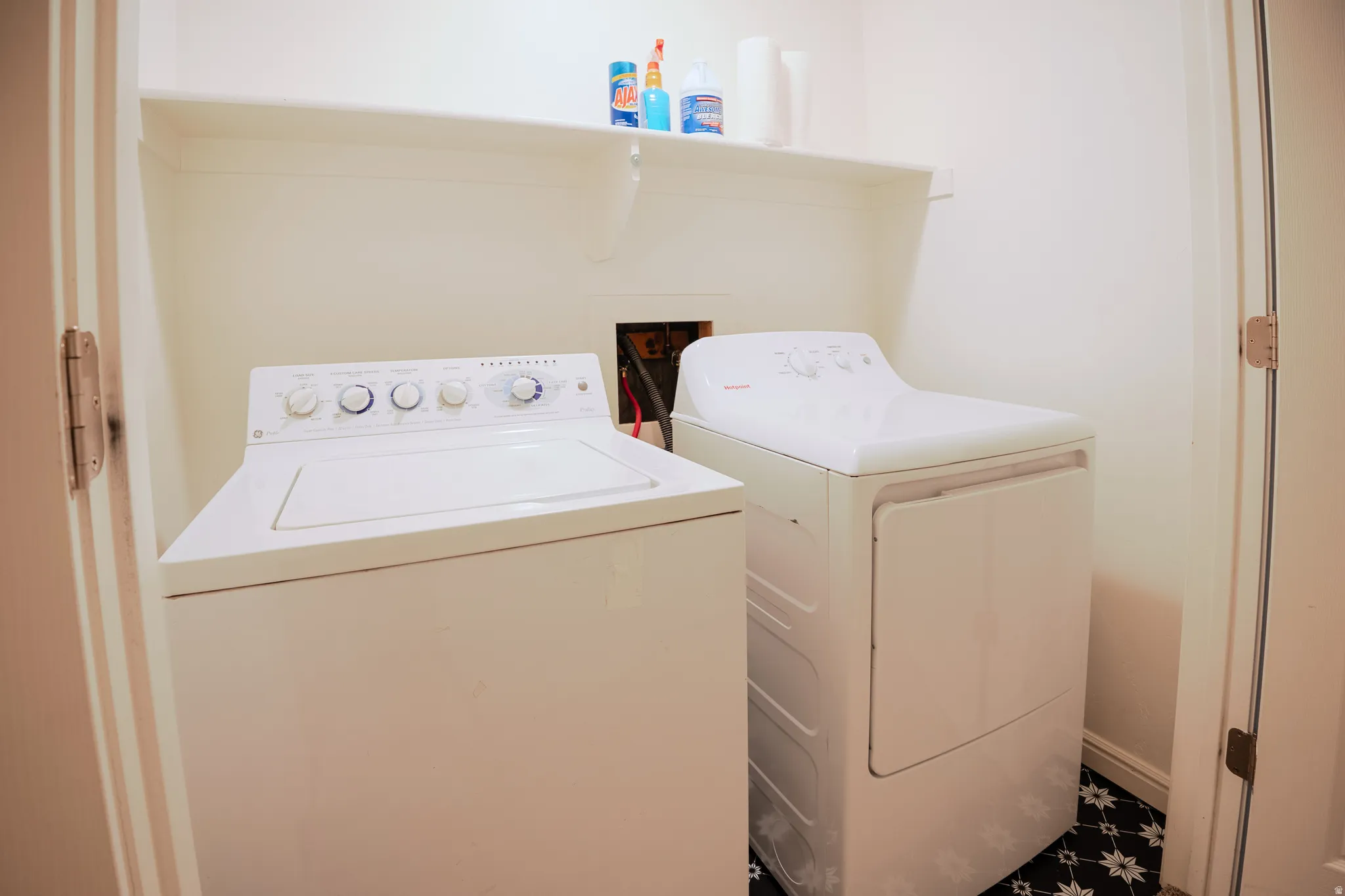 Laundry area featuring washer and clothes dryer