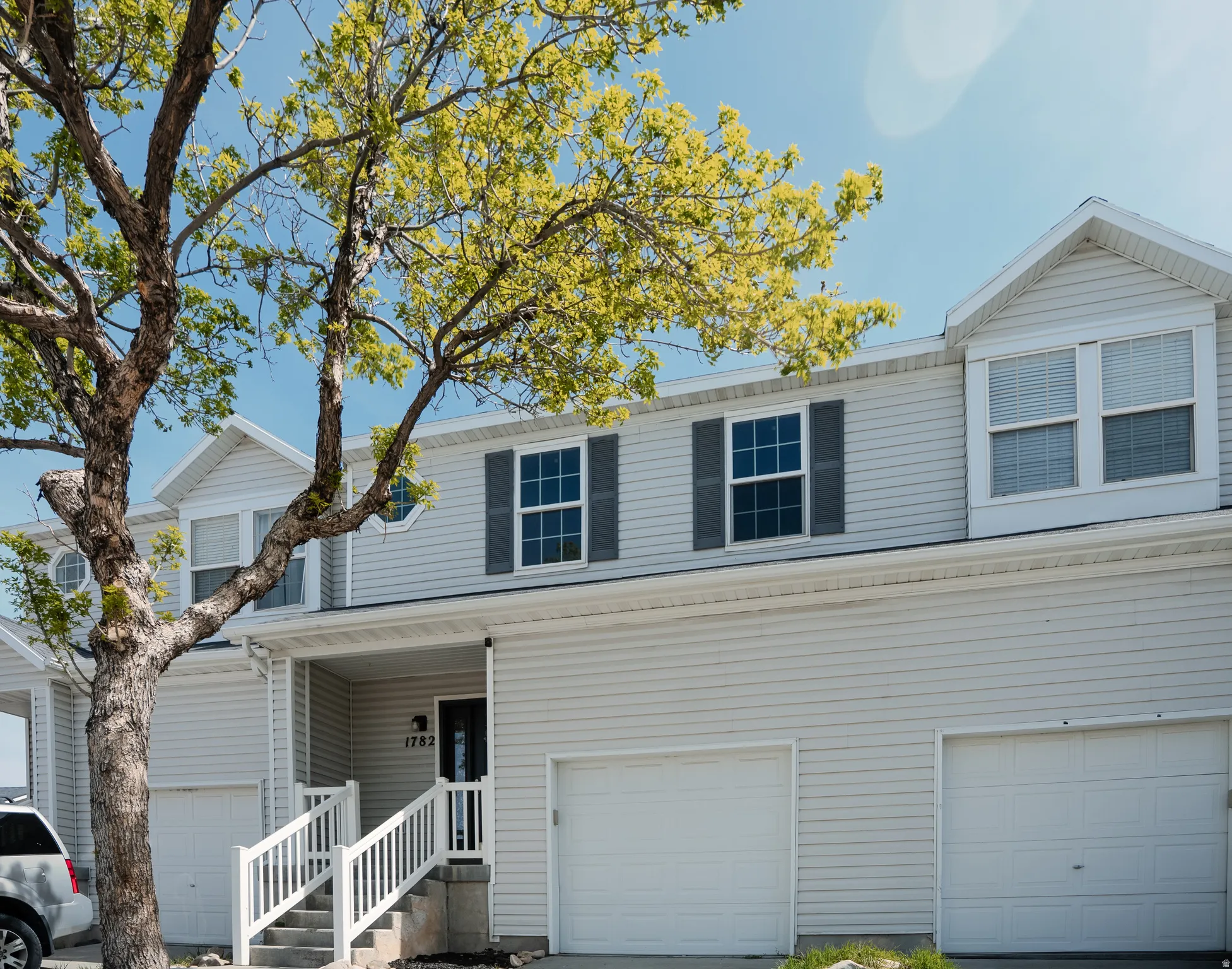 Traditional home featuring covered porch and an attached garage