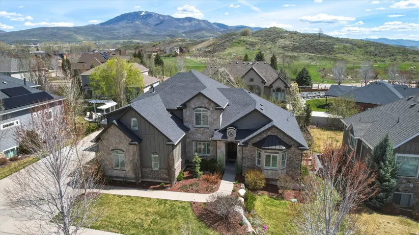 Aerial perspective of suburban area featuring a mountain backdrop
