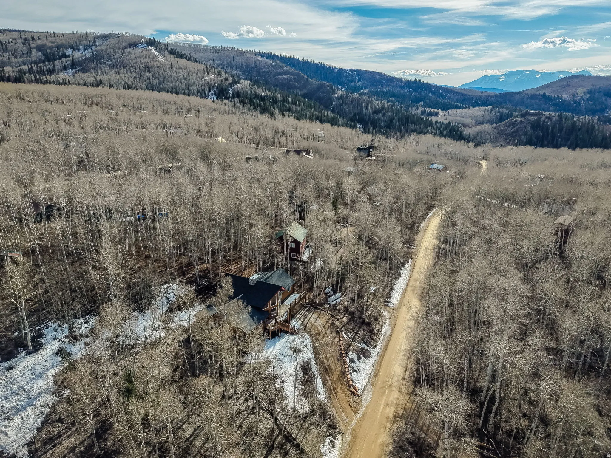 Bird's eye view of mountains and a heavily wooded area