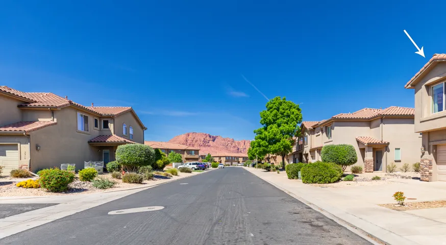 View of asphalt street with a residential view and a mountain view