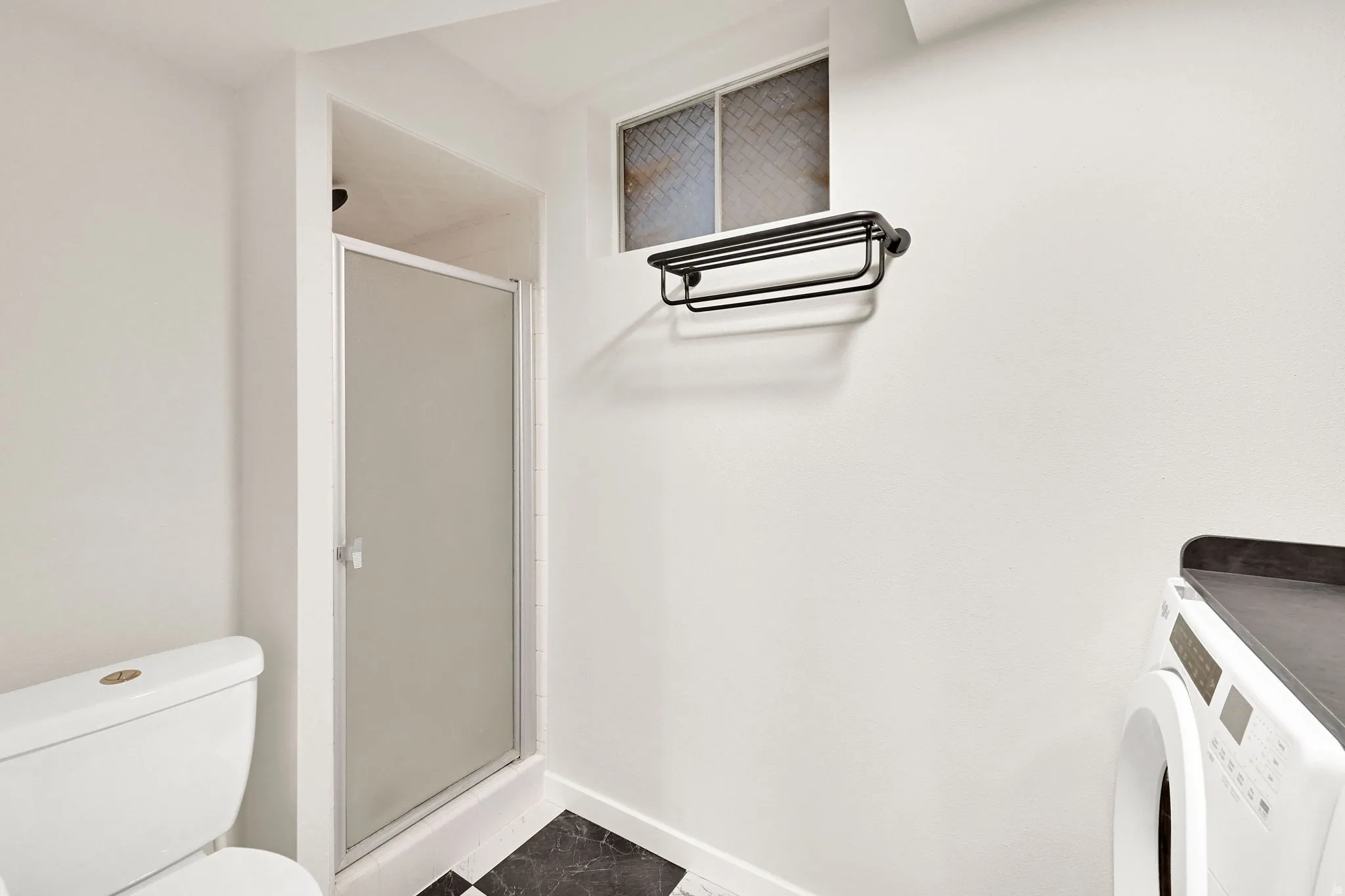 Lower level three-quarter bath and laundry