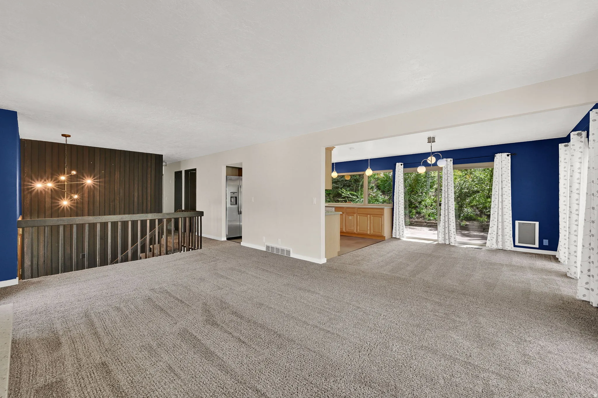 Living room flows to dining room and kitchen