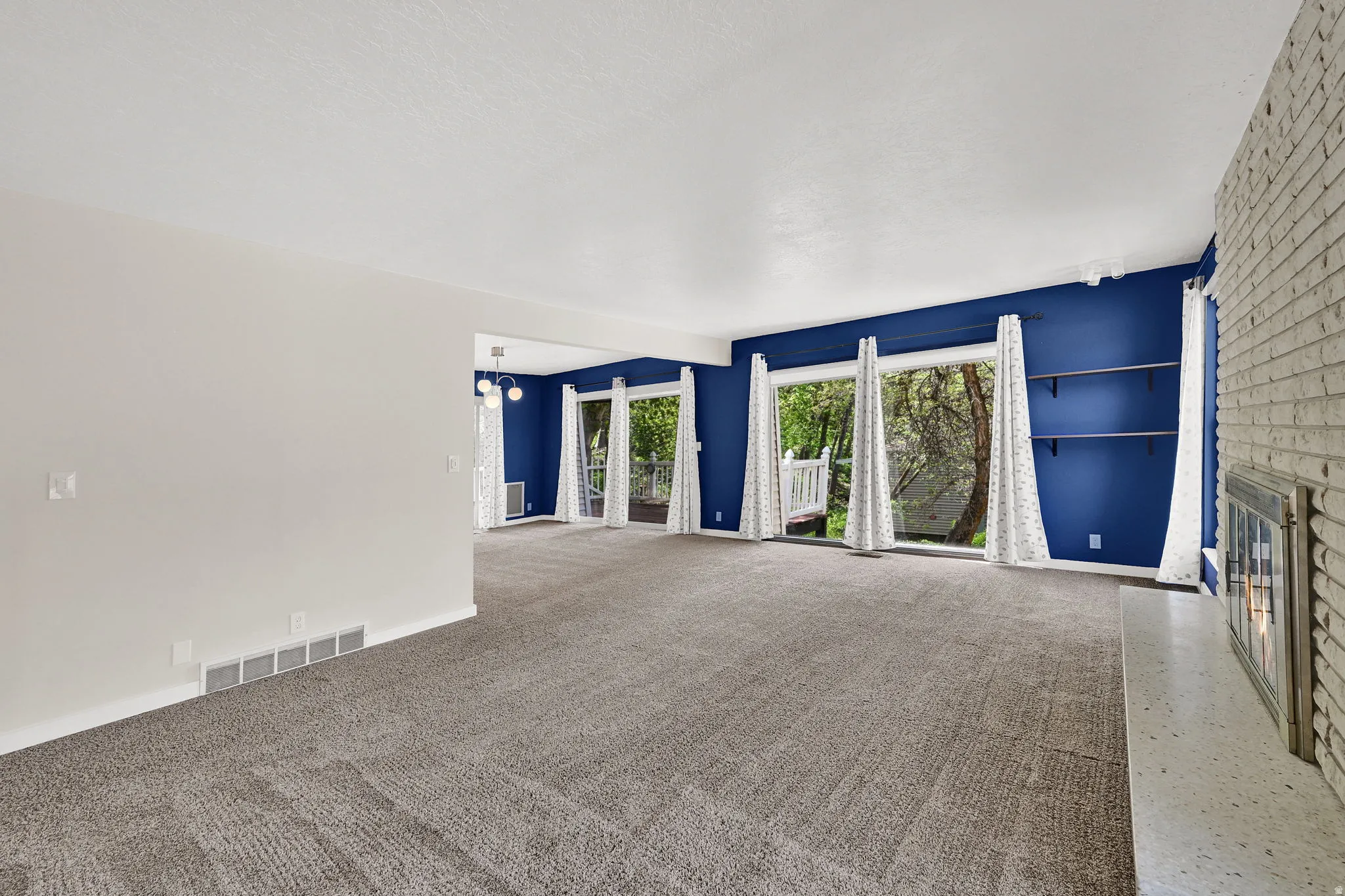 West windows and sliders offer ample light