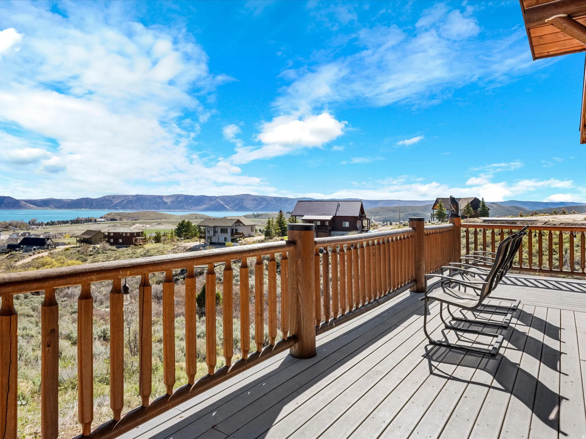 Deck with a mountain view and a residential view