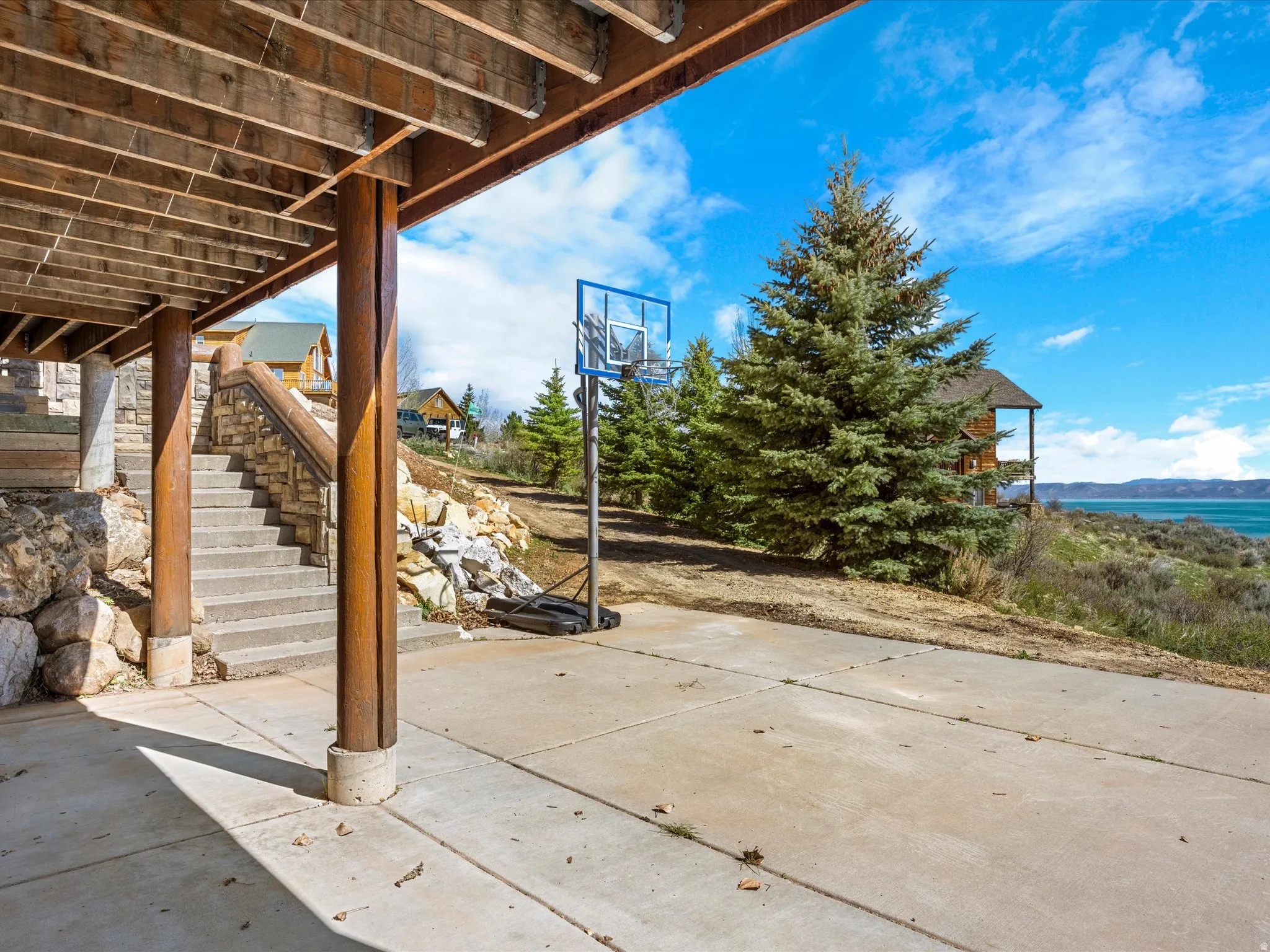 View of patio with stairs and a mountain view