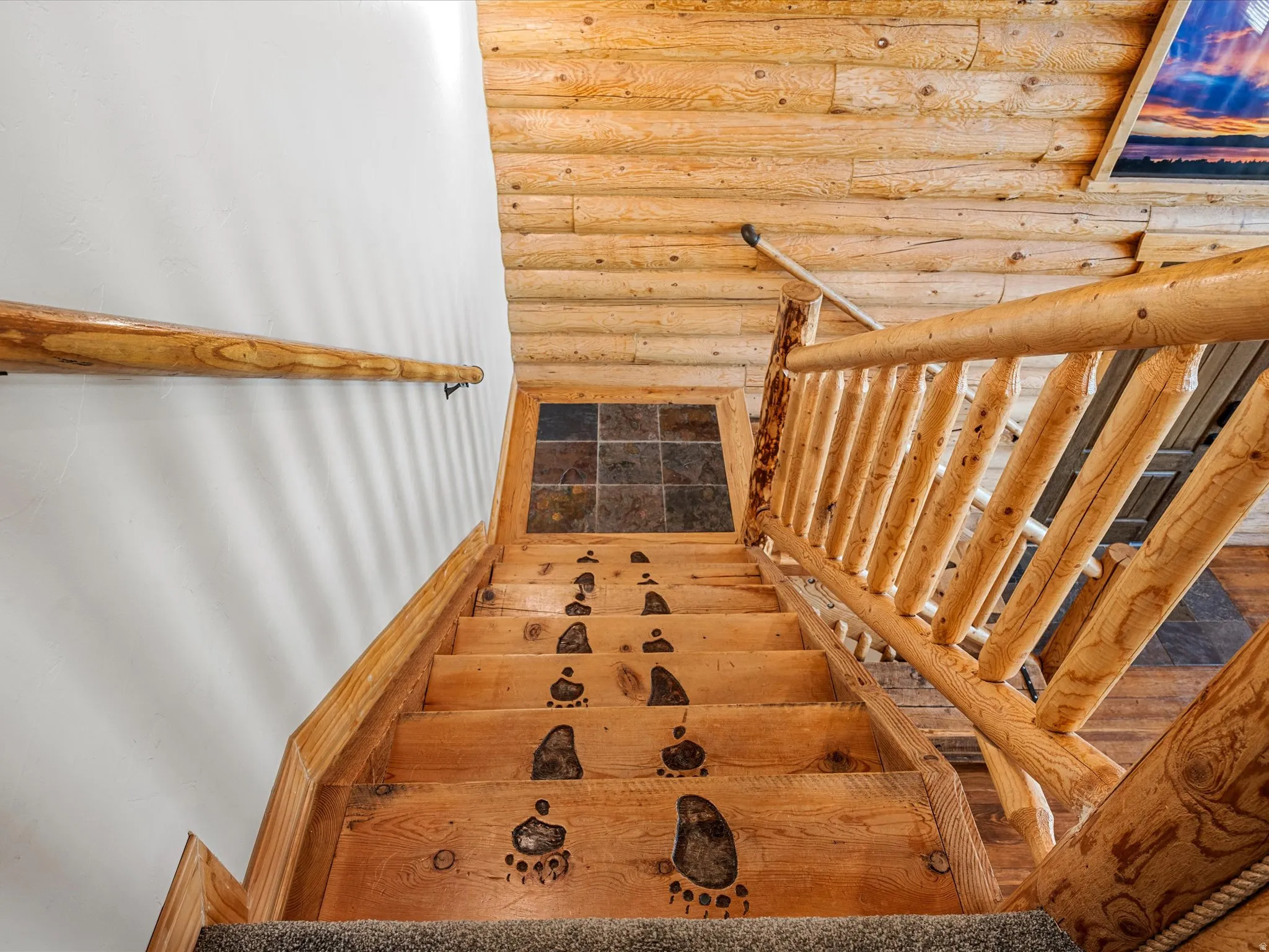 Stairs featuring rustic walls