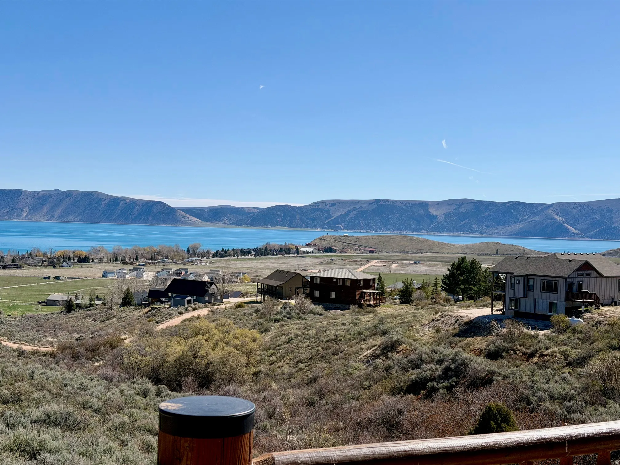 View of mountain backdrop featuring a nearby body of water