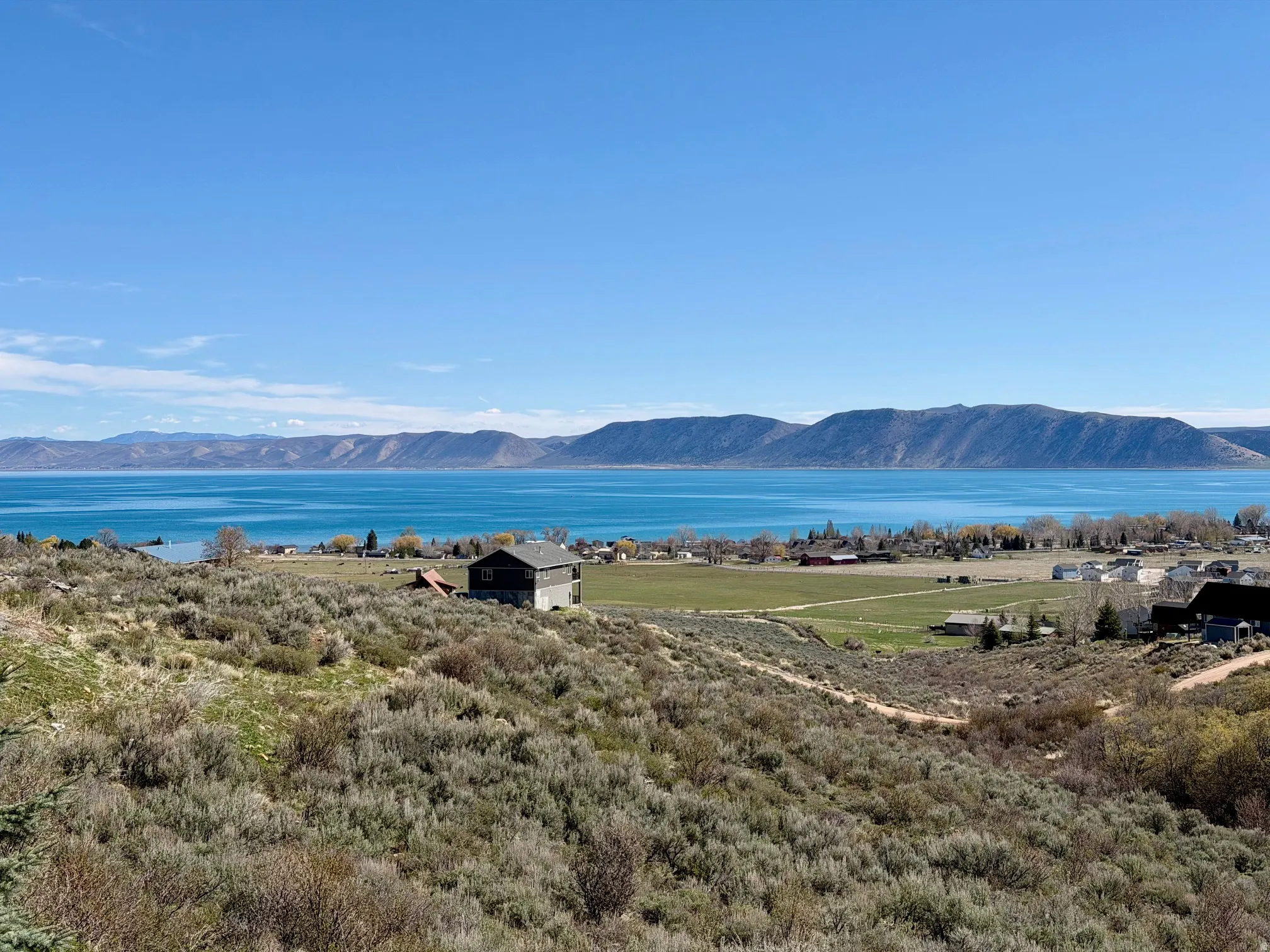View of mountain backdrop with a nearby body of water