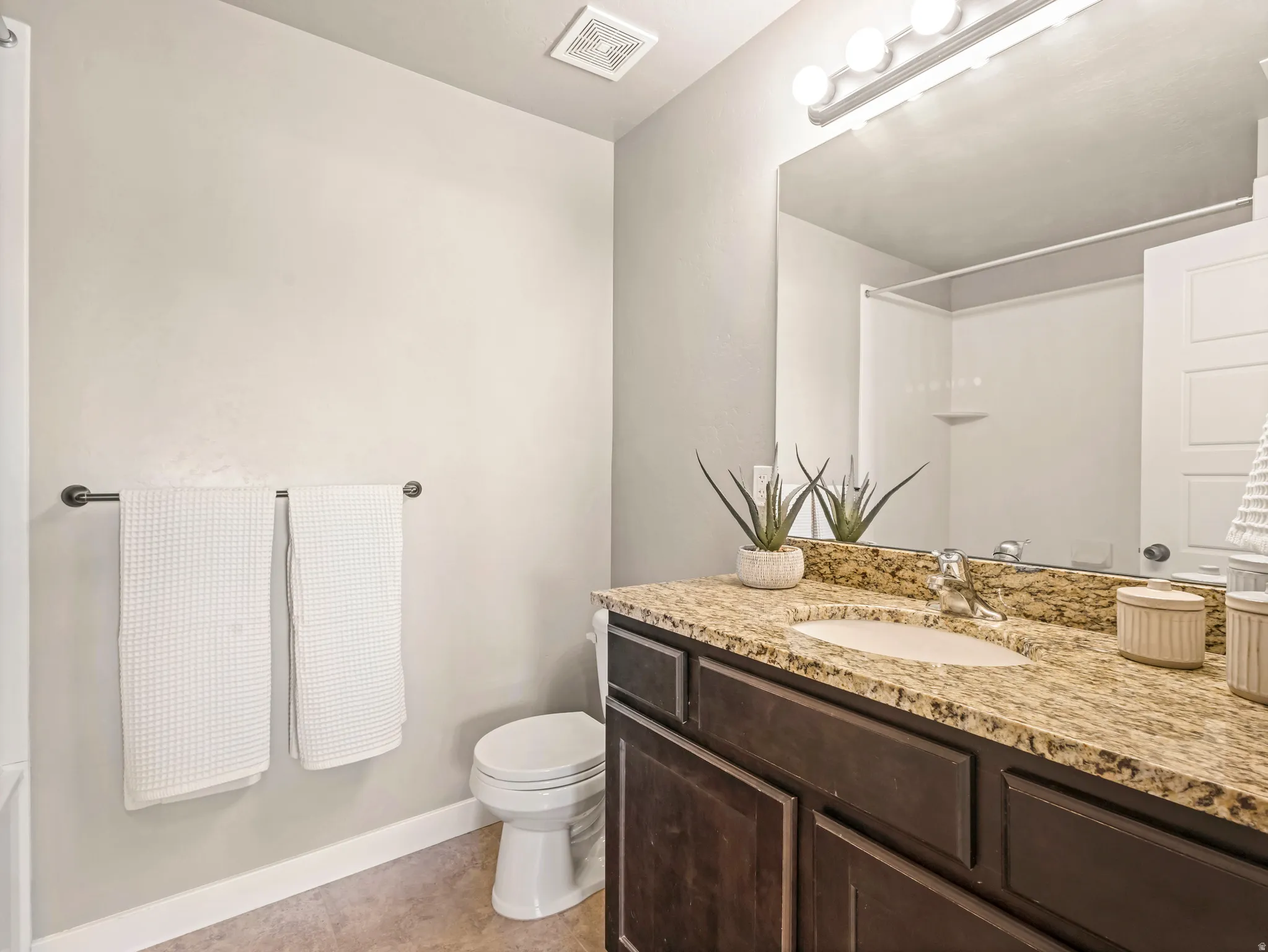 Primary Bathroom featuring vanity and a tub/shower