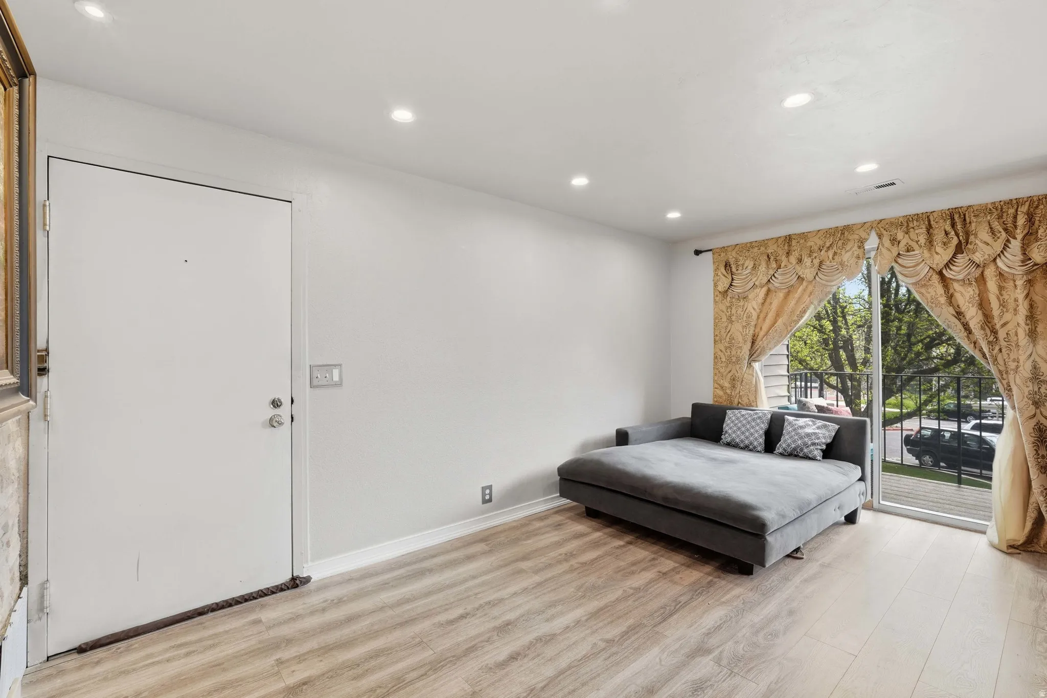 Sitting room featuring light wood-type flooring and recessed lighting