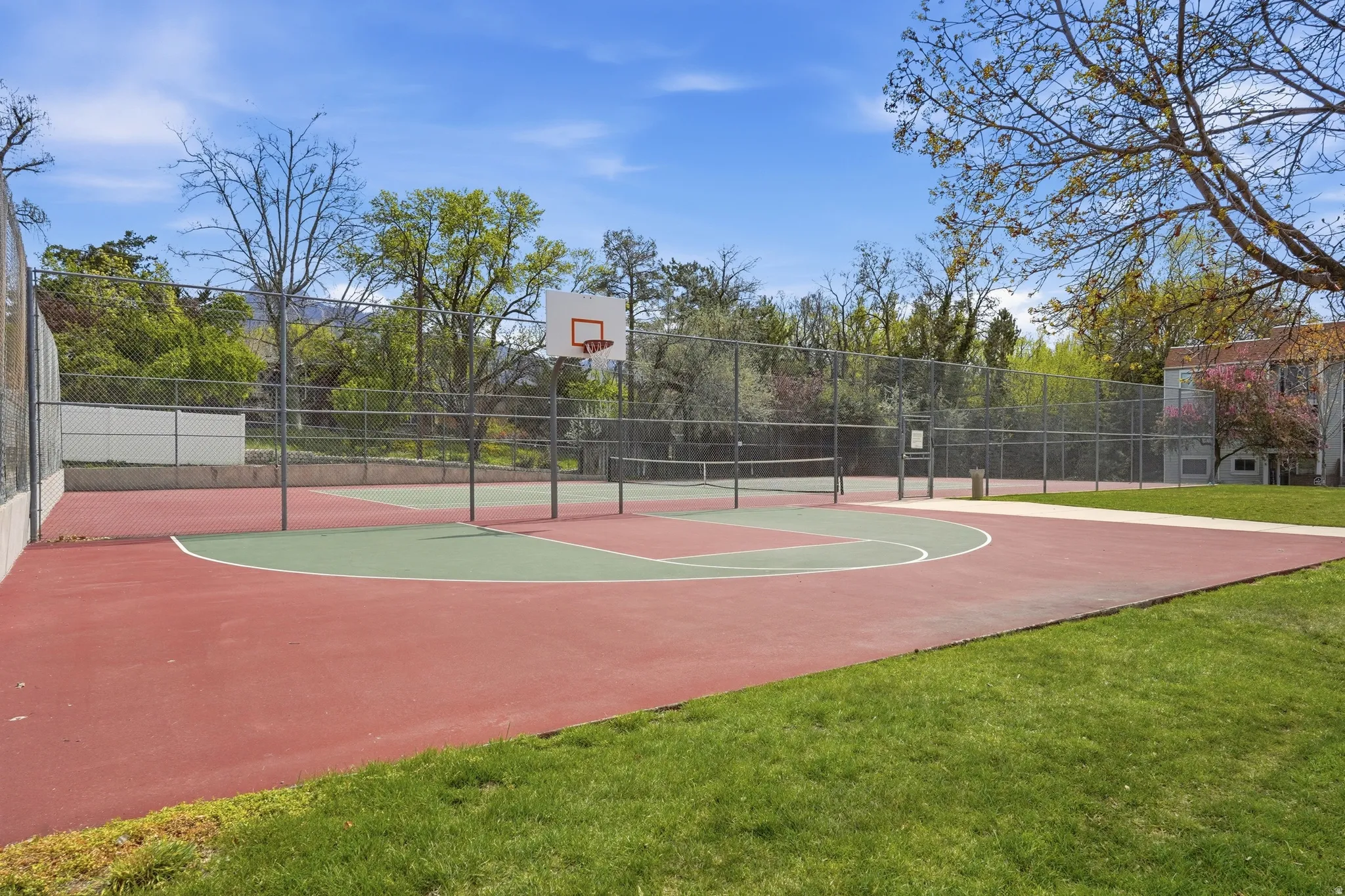View of basketball court featuring community basketball court and a tennis court