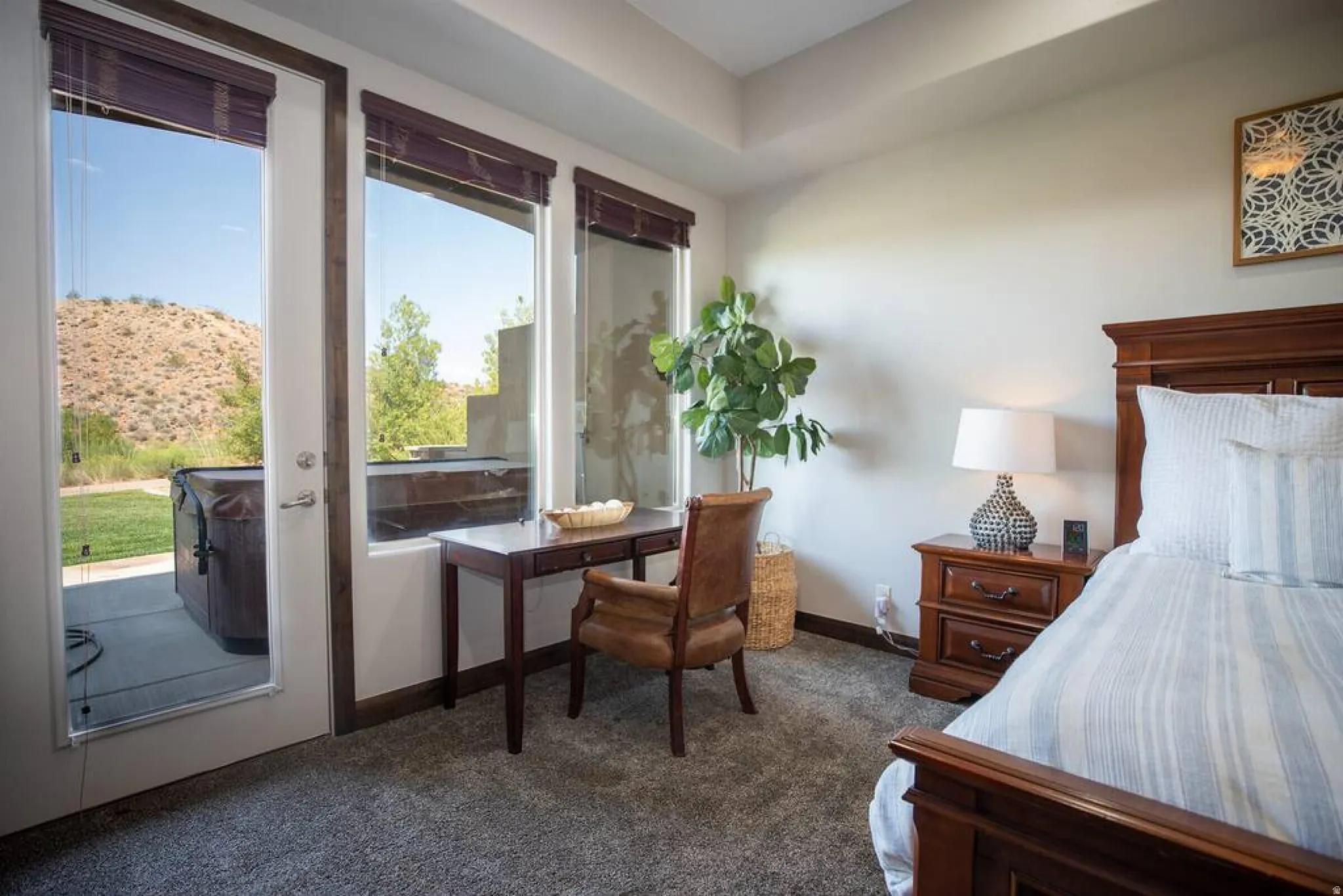 Bedroom featuring dark colored carpet and access to outside