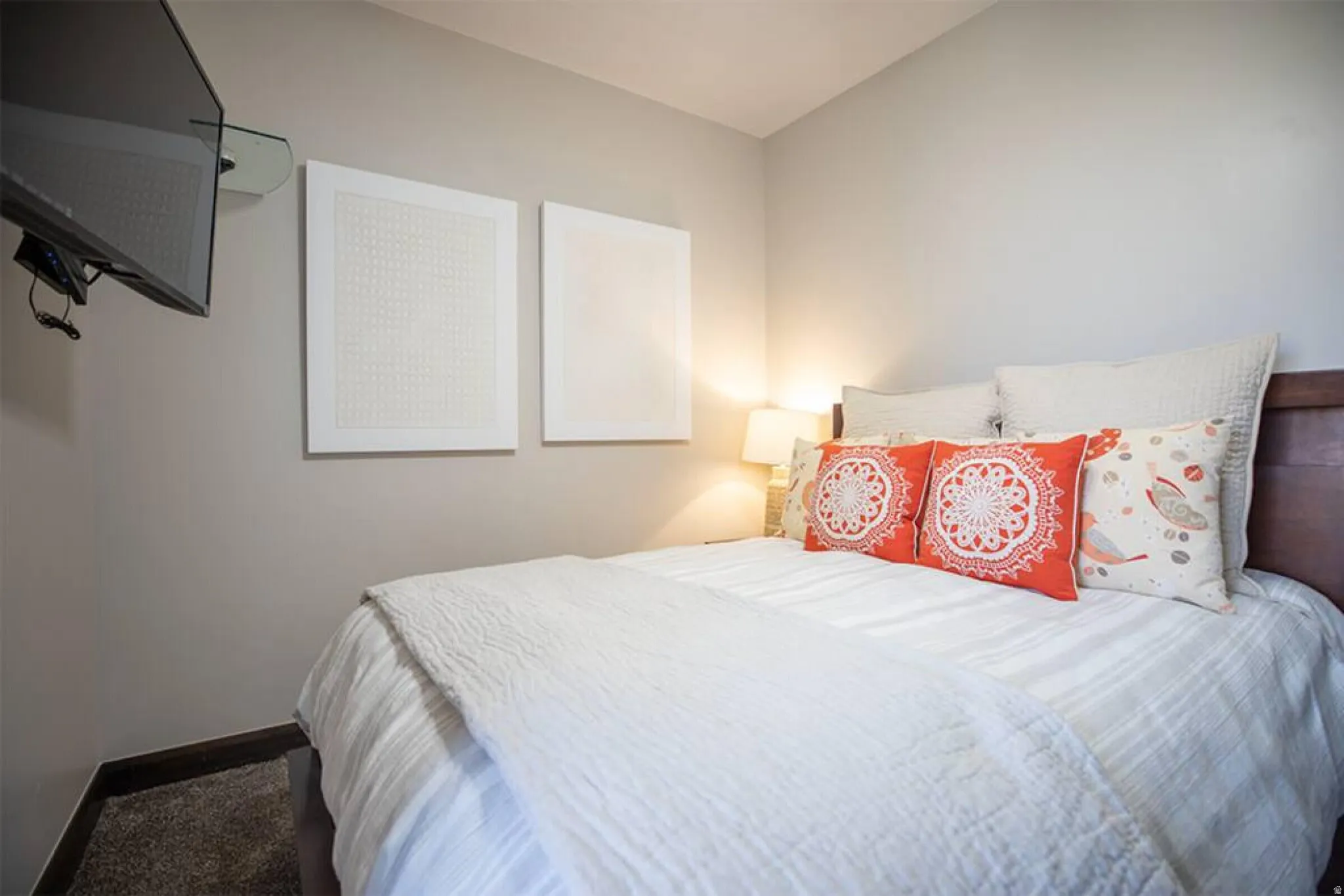 Bedroom featuring baseboards and carpet