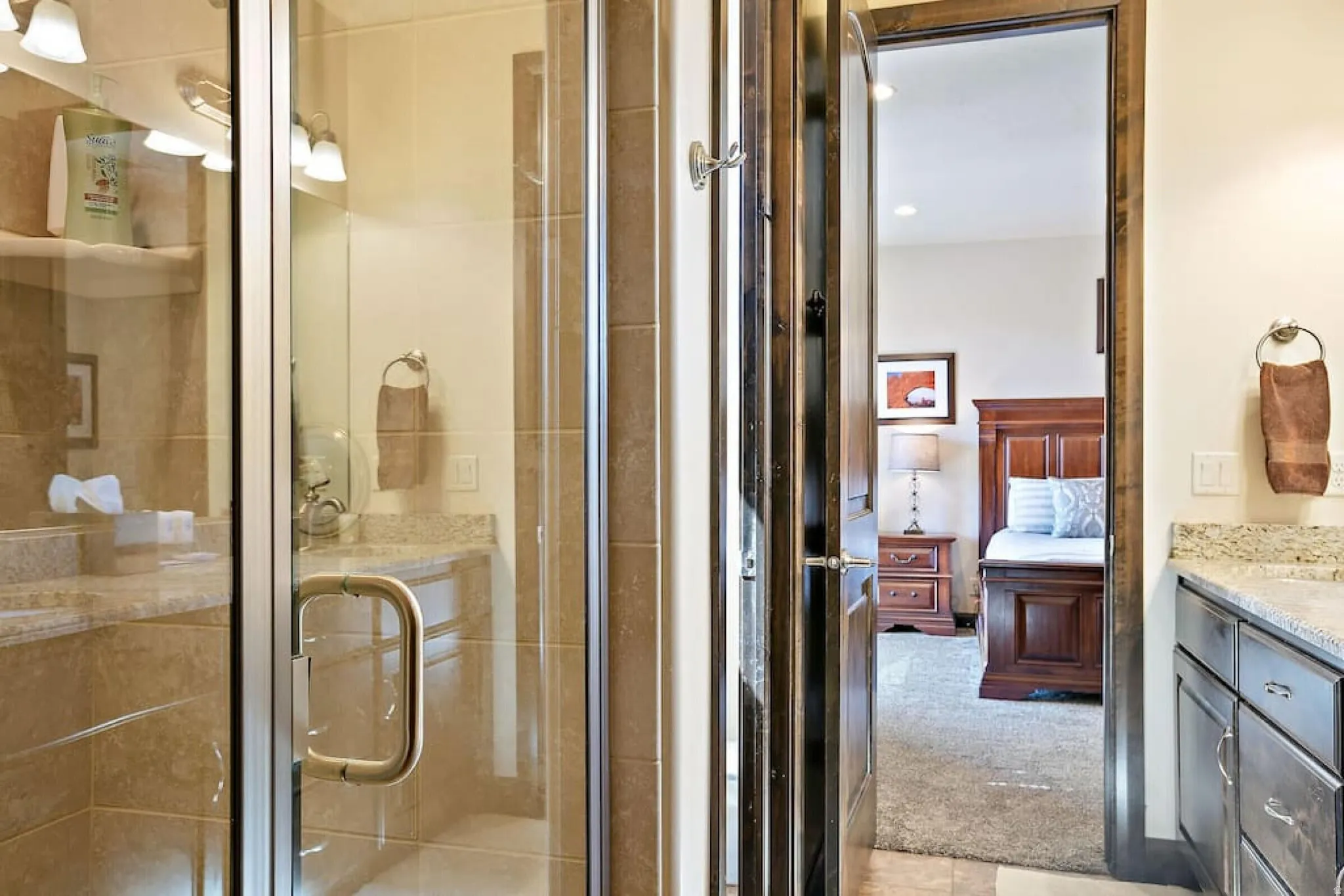 Ensuite bathroom featuring vanity, a shower stall, recessed lighting, and light carpet