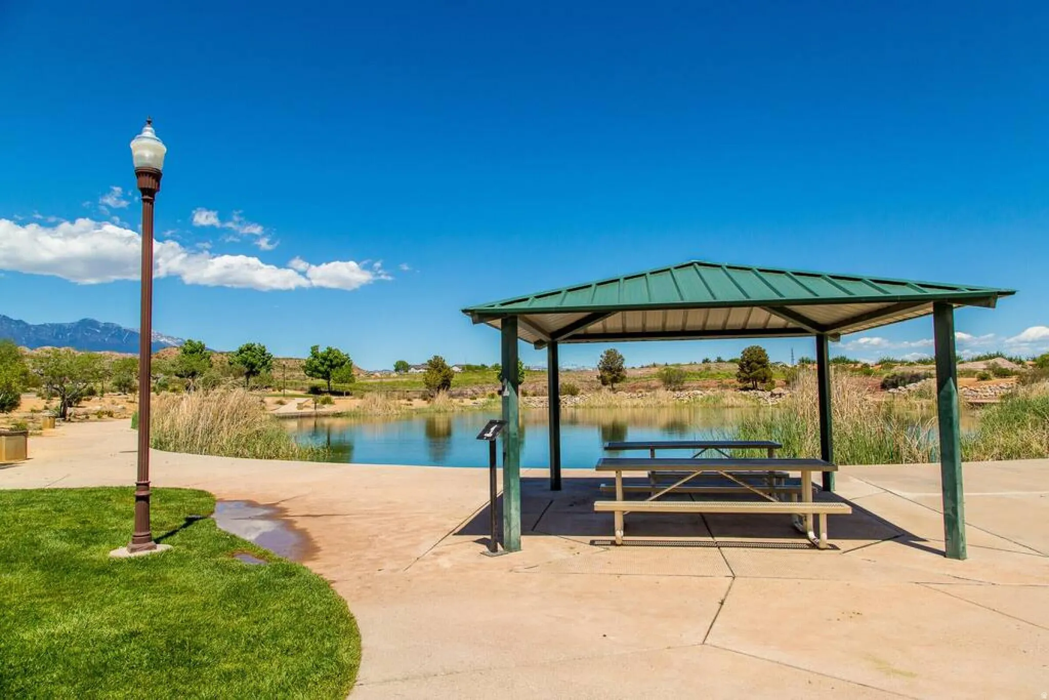View of home's community with a patio, a water view, and a gazebo