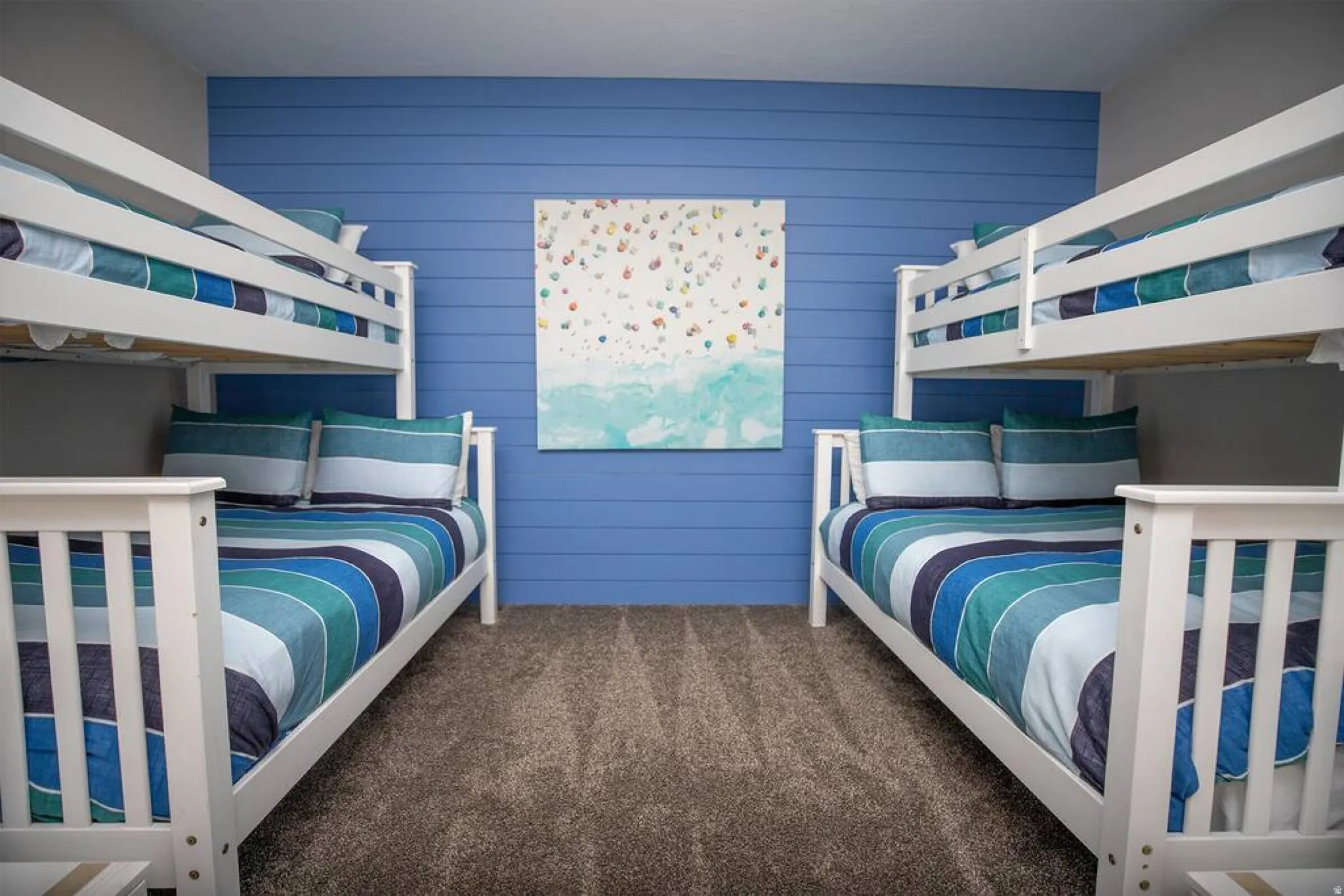 Bedroom with dark carpet and wooden walls