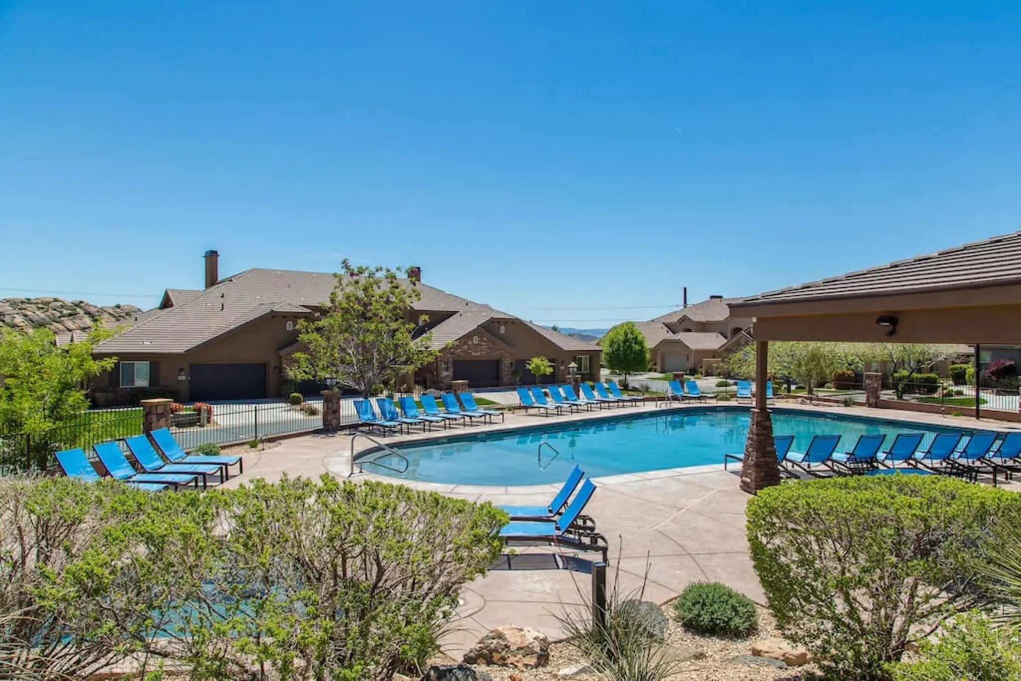 Community pool with a patio
