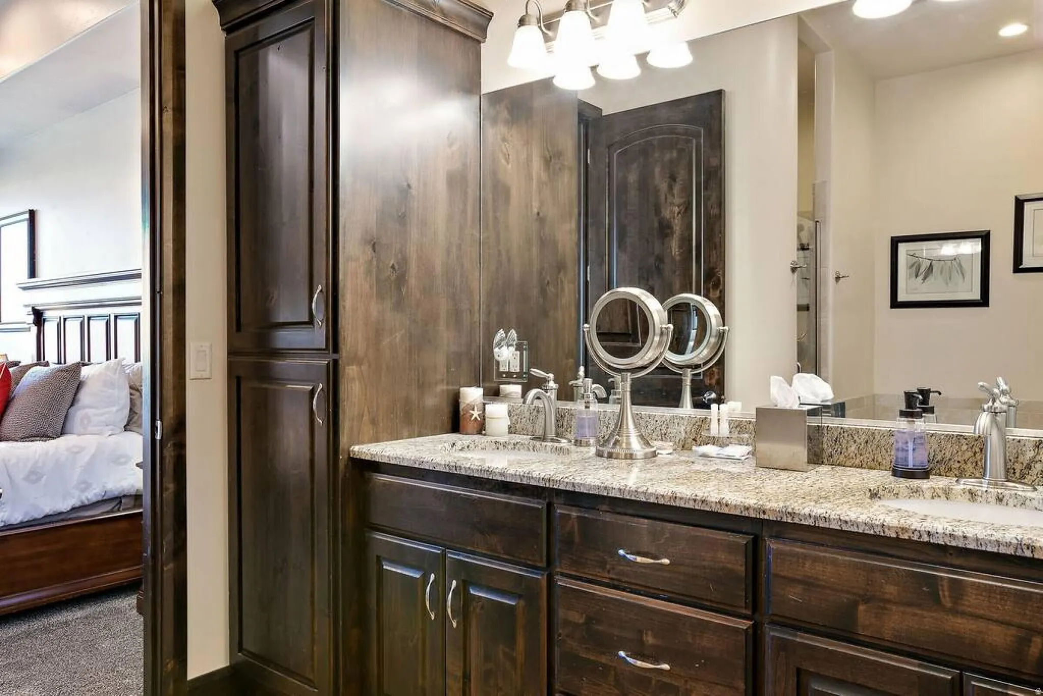 Bathroom featuring double vanity and connected bathroom