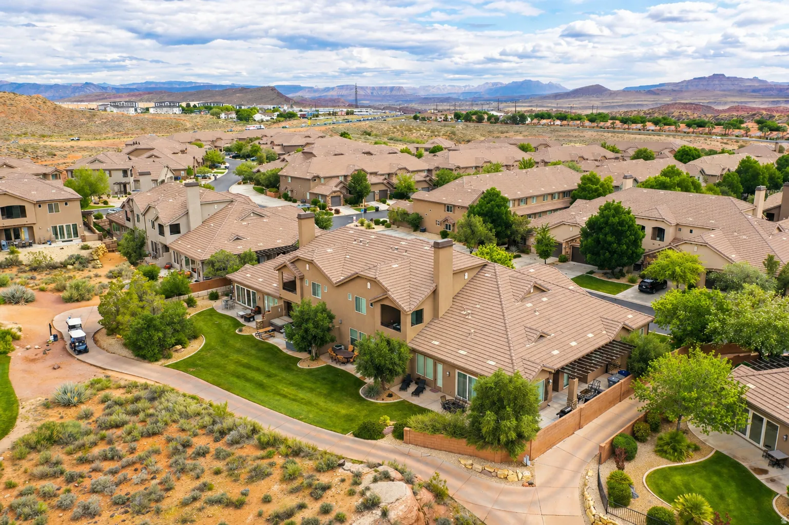 Aerial view of residential area with a mountainous background