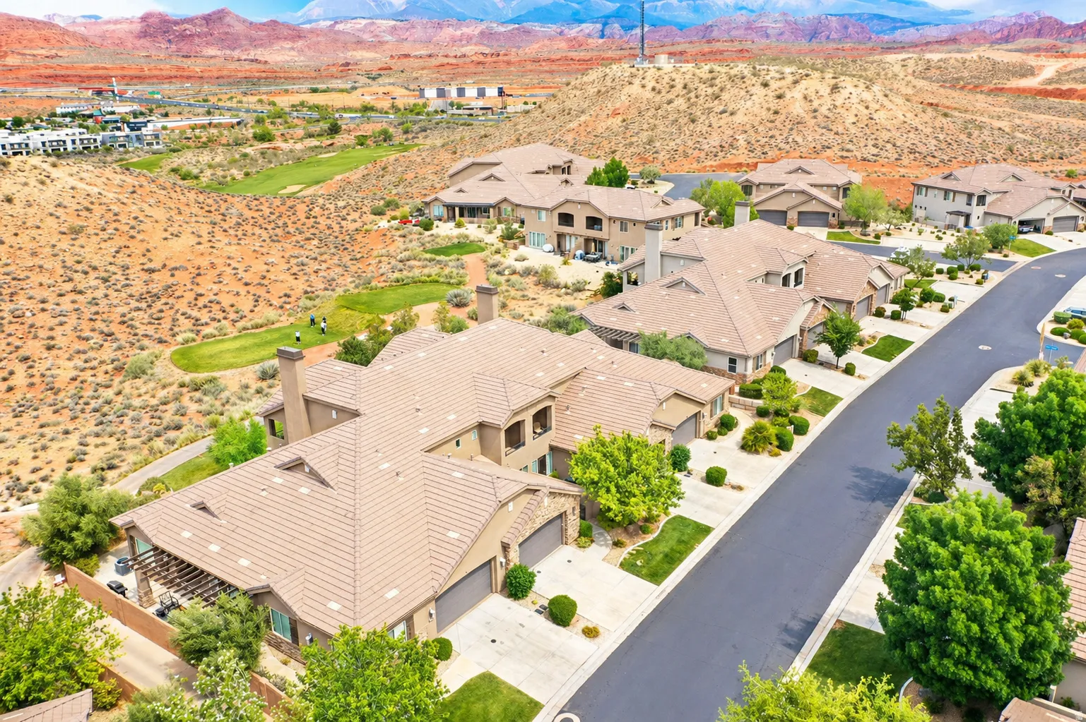 Aerial view of residential area featuring mountains