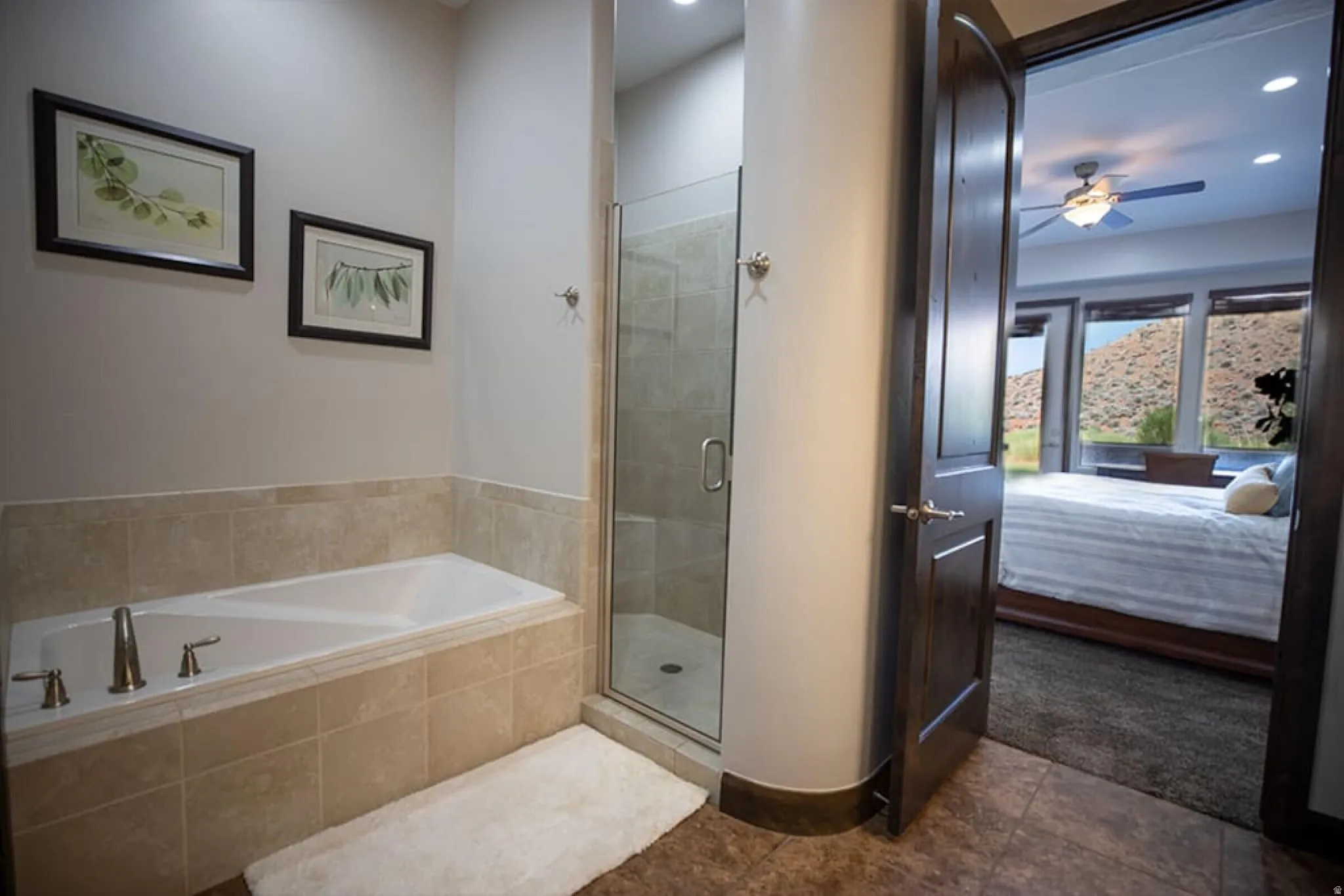 Full bathroom featuring connected bathroom, a bath, a ceiling fan, a stall shower, and recessed lighting