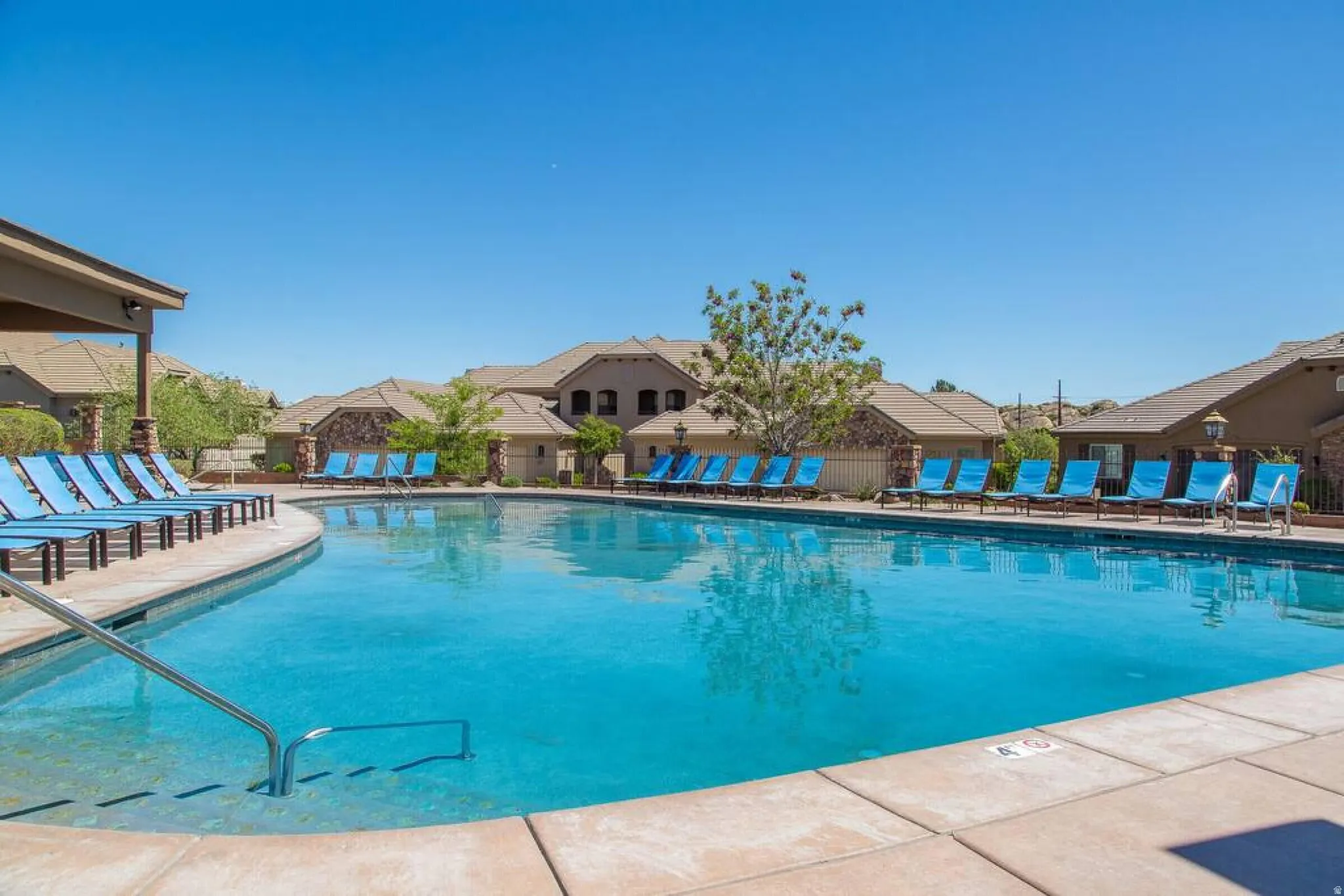 Community pool featuring a patio