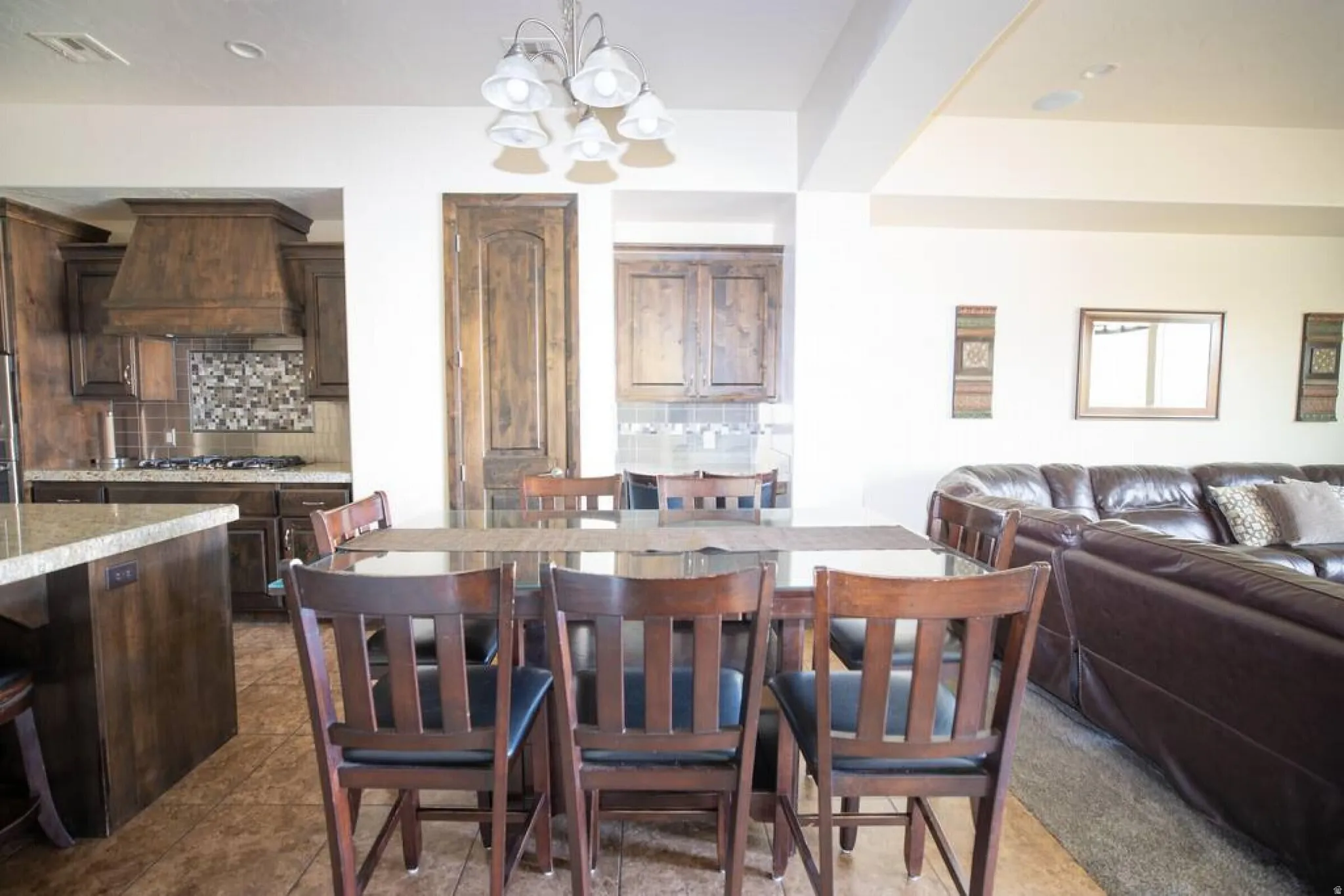 Dining space featuring suspended lighting