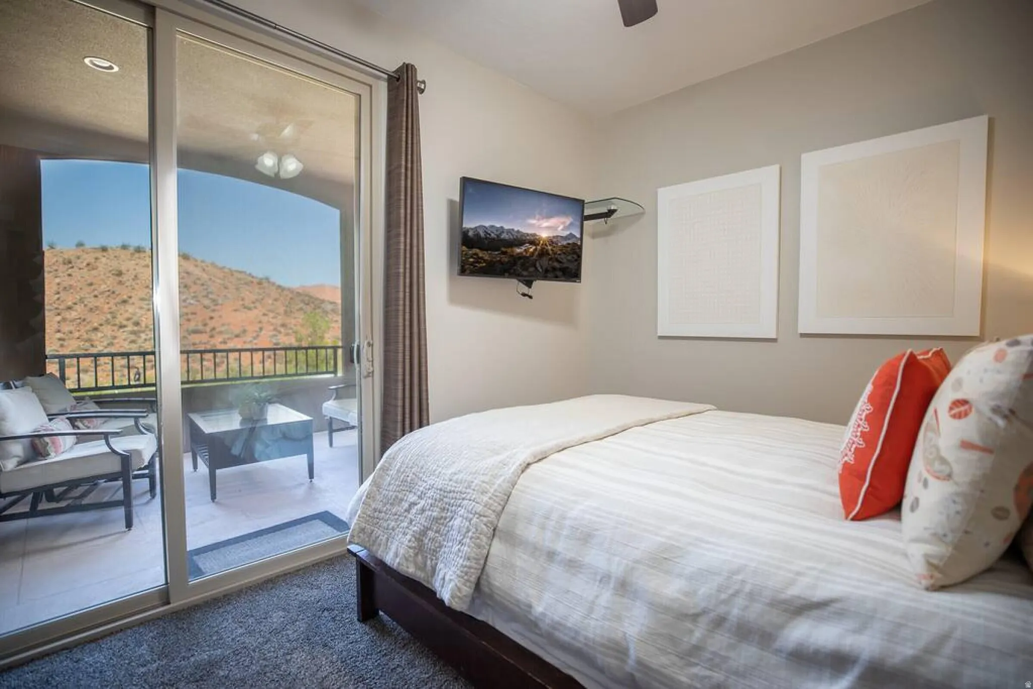 Bedroom featuring dark colored carpet, access to exterior, and ceiling fan
