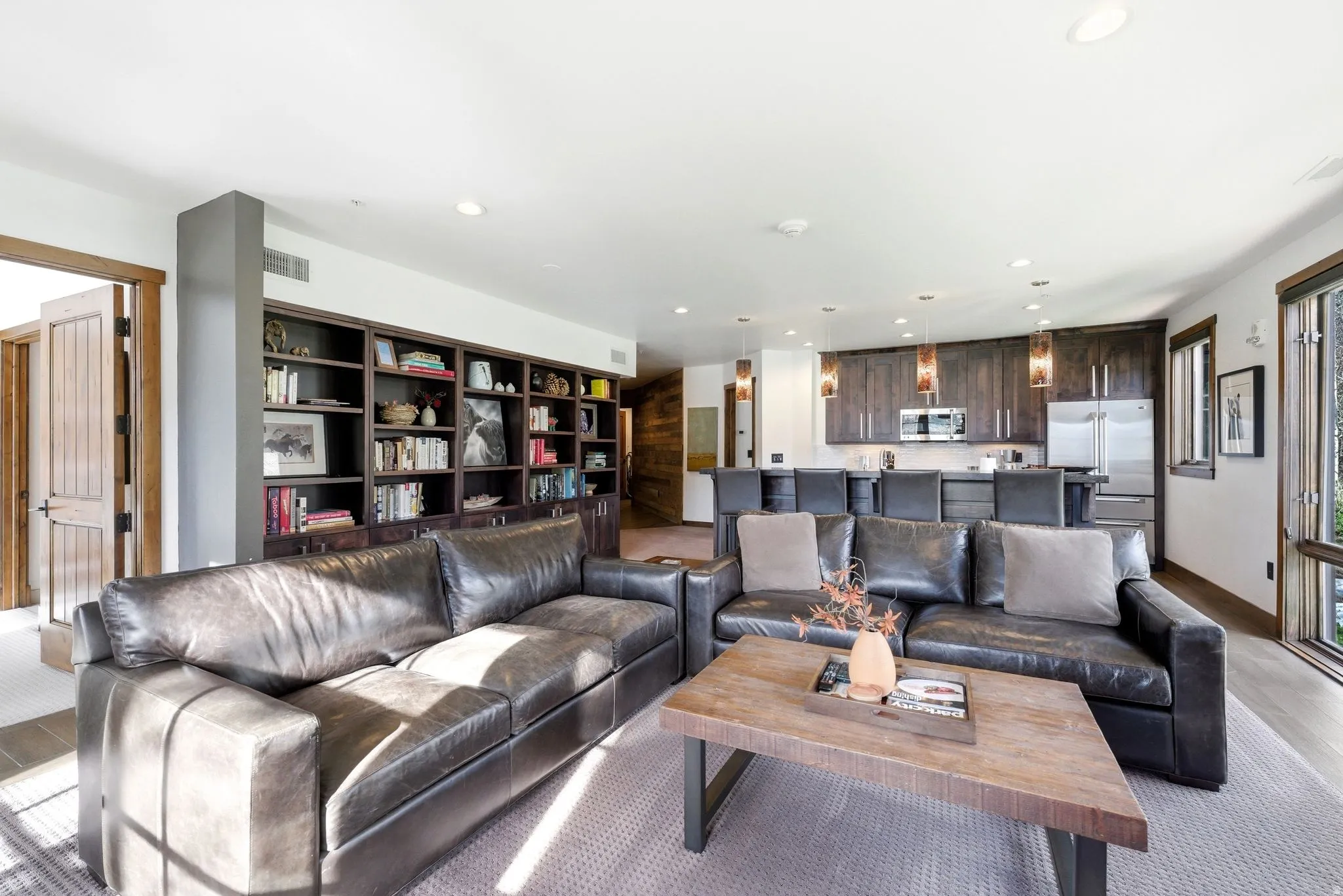 Living area with recessed lighting and baseboards