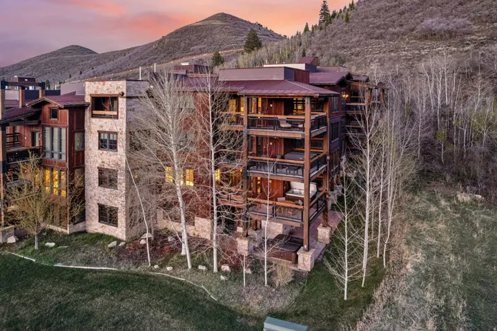 Property at dusk featuring a mountain view