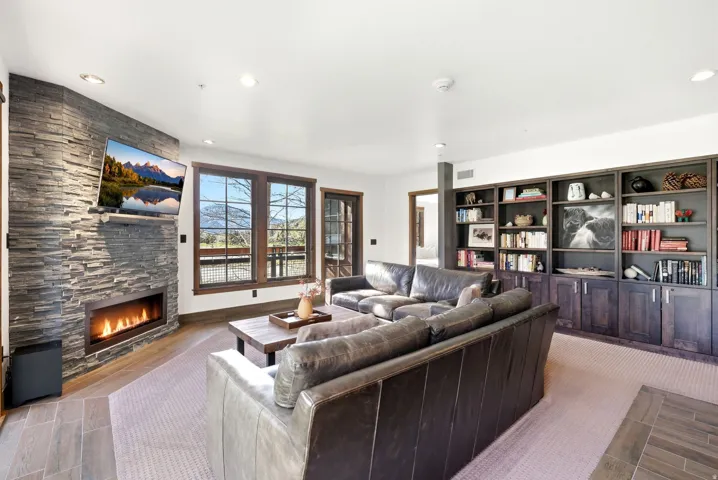 Living area featuring a fireplace and recessed lighting