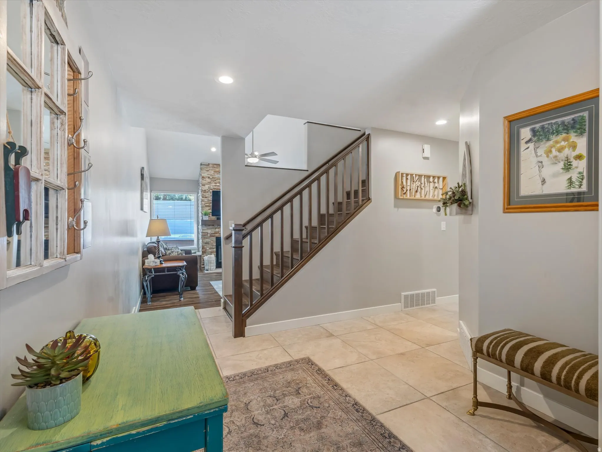 Entrance foyer featuring ceiling fan and recessed lighting