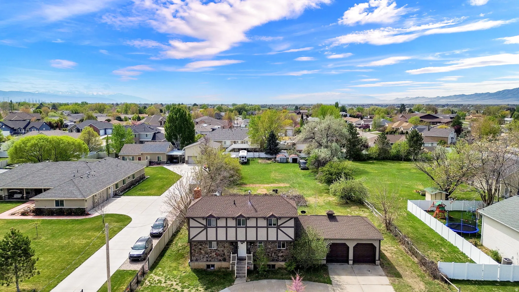Aerial view of residential area featuring mountains