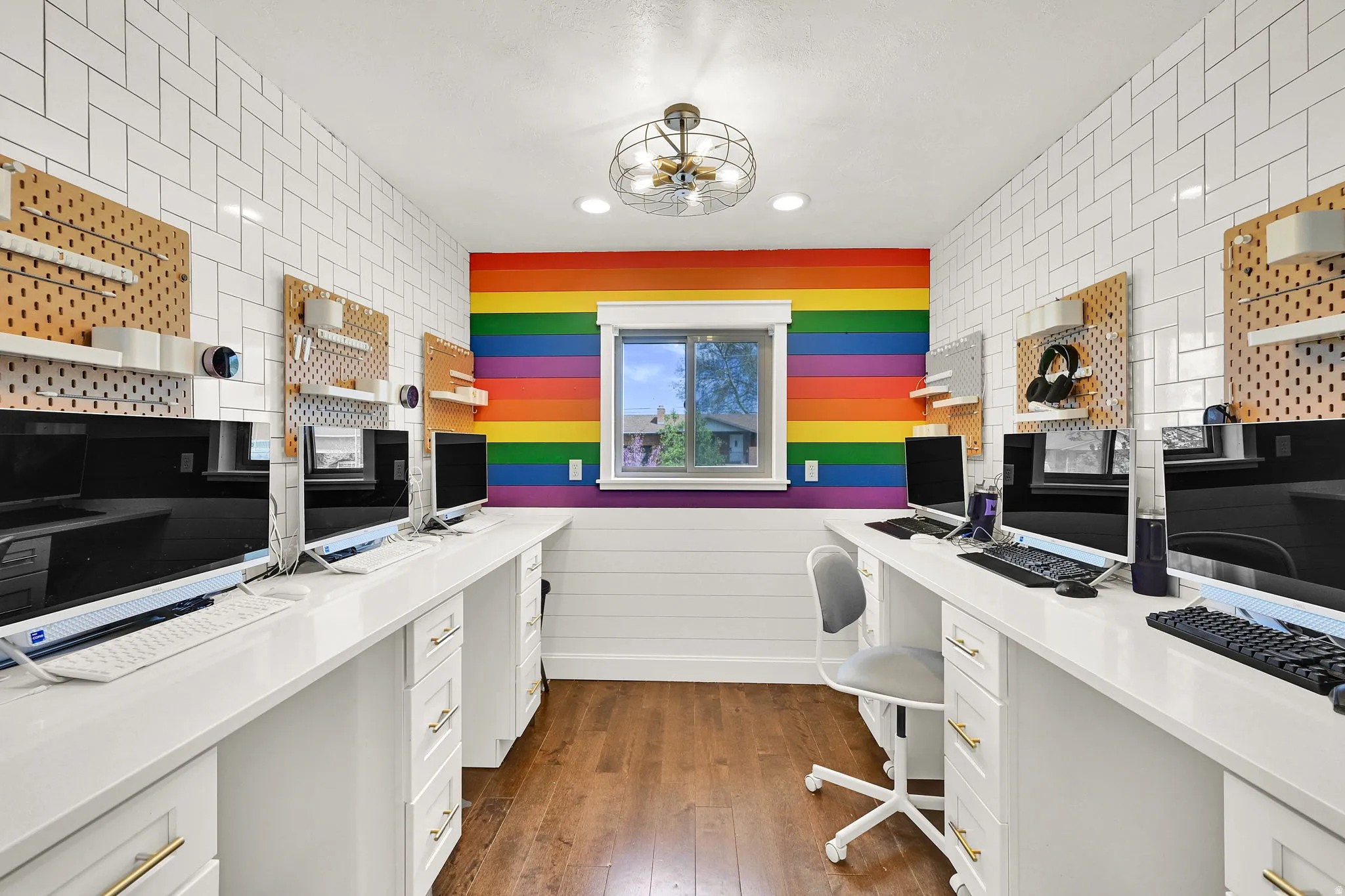 Office with built in study area, dark wood-type flooring, and recessed lighting
