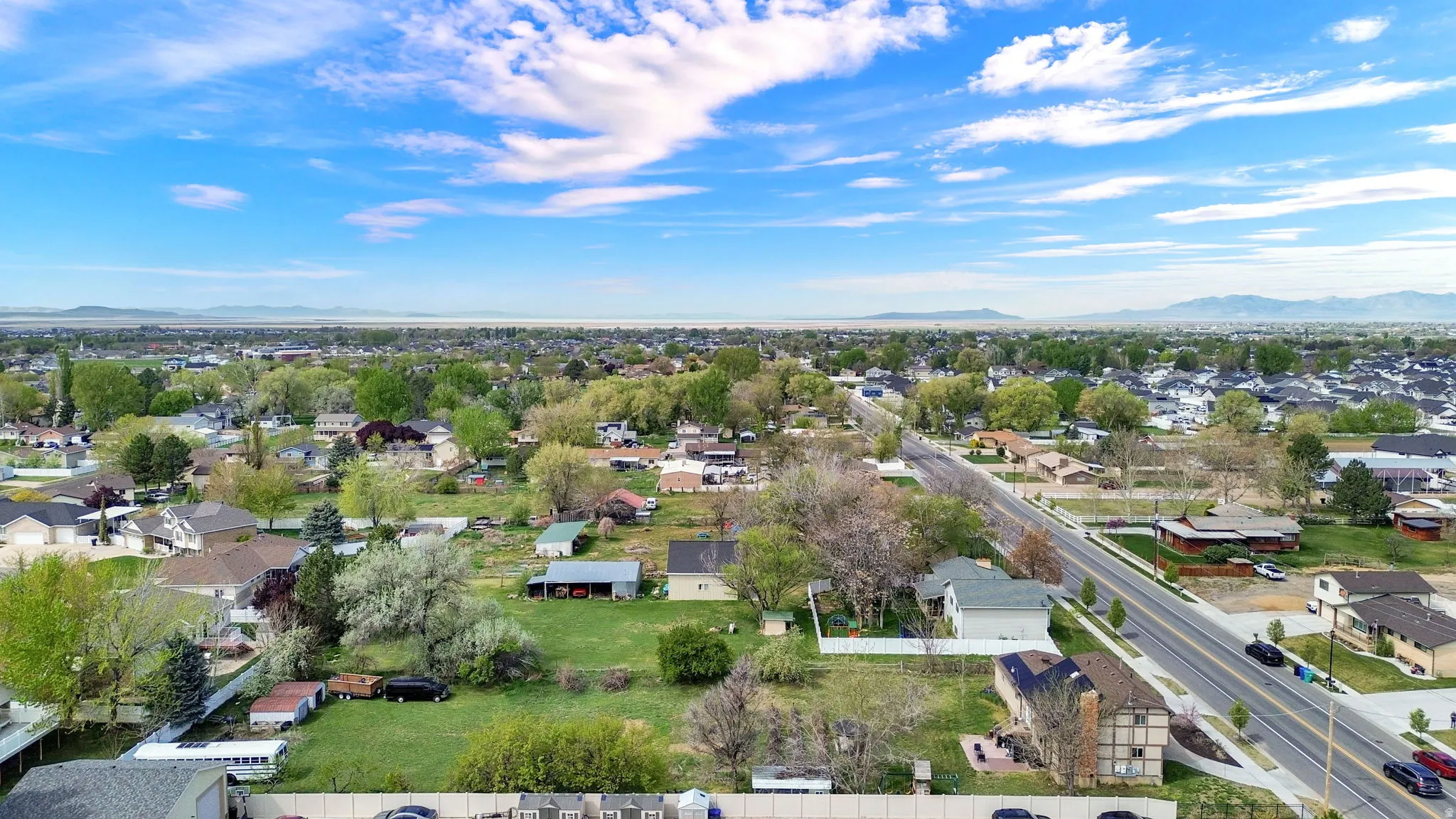 Aerial perspective of suburban area featuring a mountainous background
