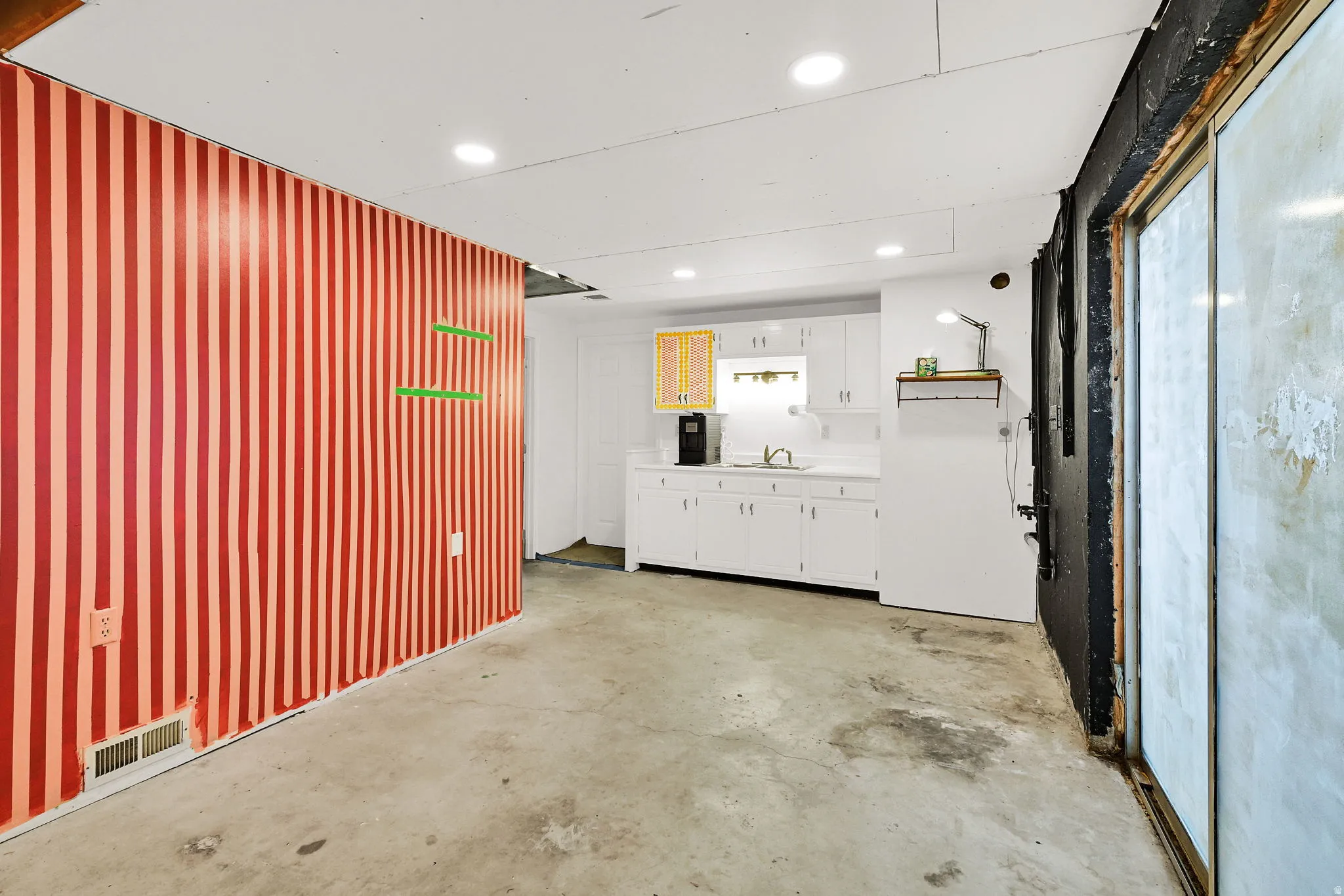 Garage with recessed lighting and a sink